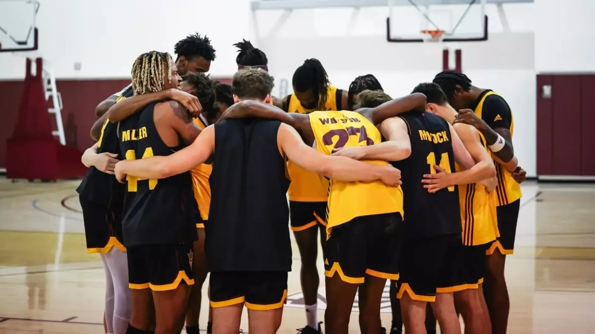 Men's Basketball huddled Men's Basketball huddled