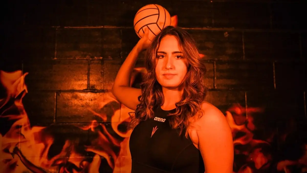 woman holding water polo ball woman holding water polo ball