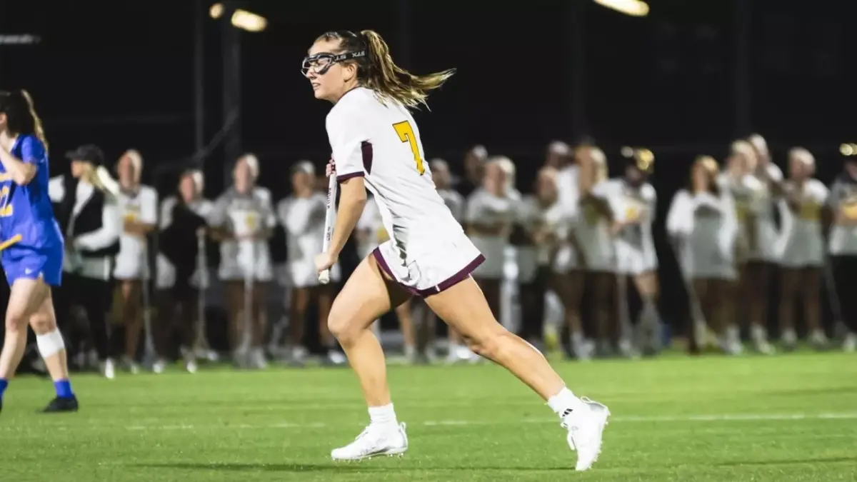 lacrosse player running lacrosse player running