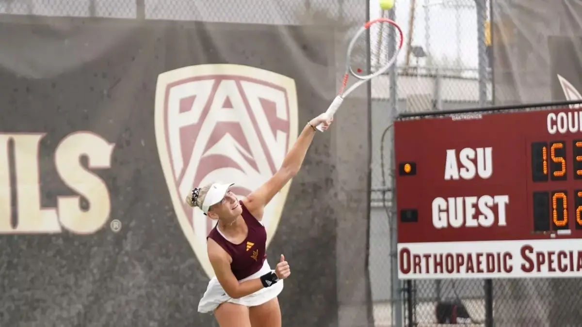 woman tennis player holding racket out woman tennis player holding racket out