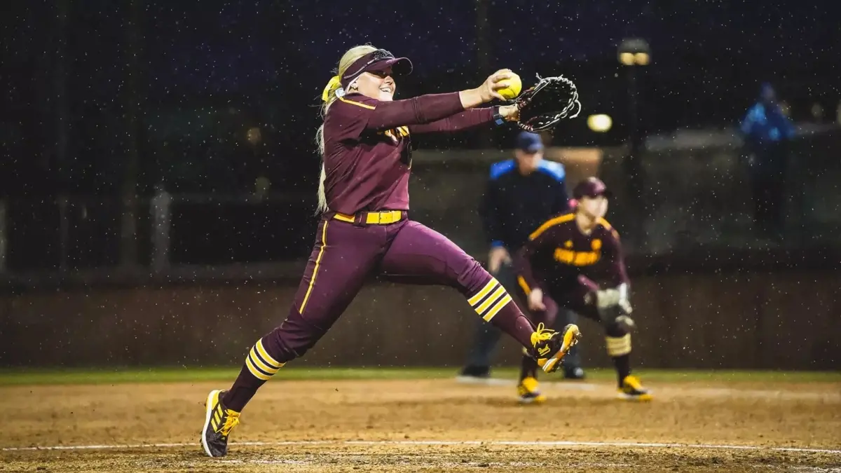 softball player throwing ball softball player throwing ball