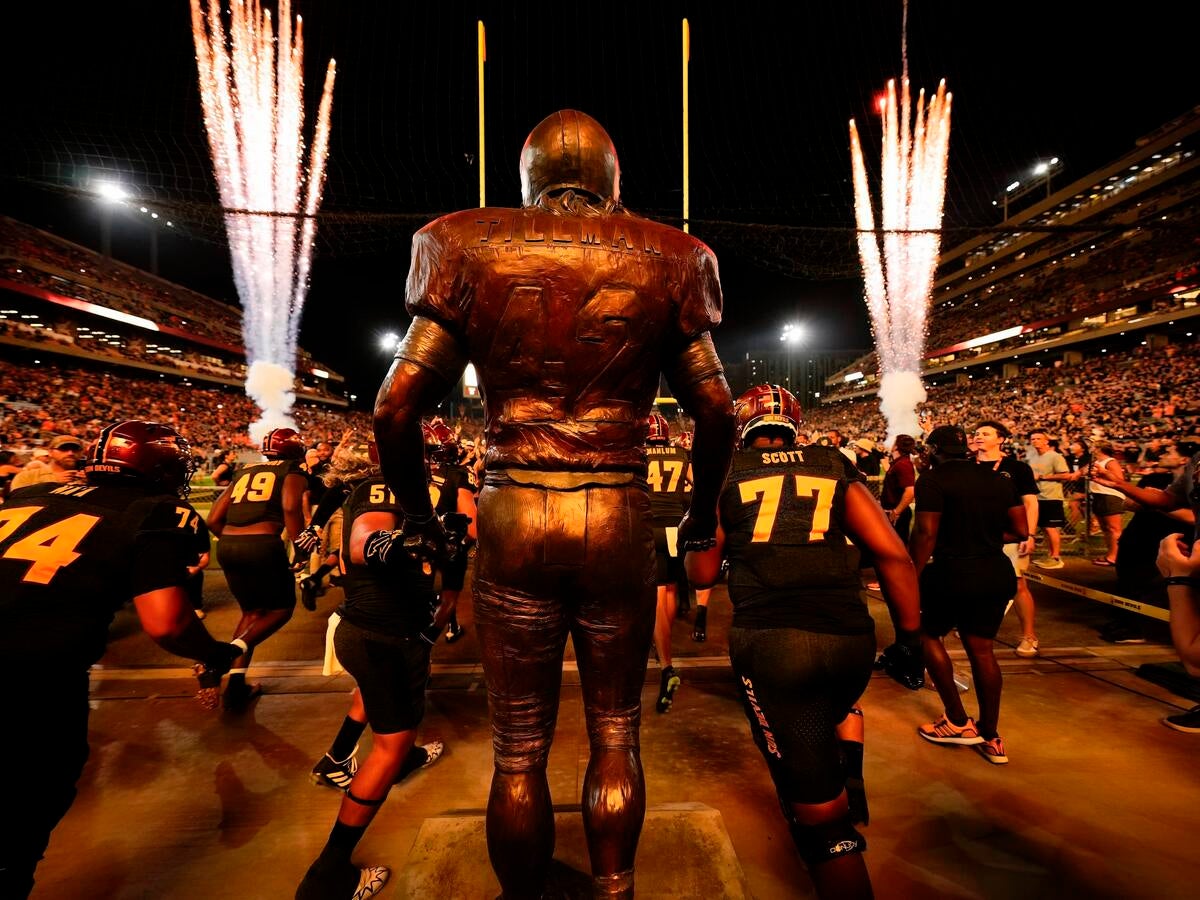 Sun Devil Football running out of tunnel for Salute to Service game with Pat Tillman statue