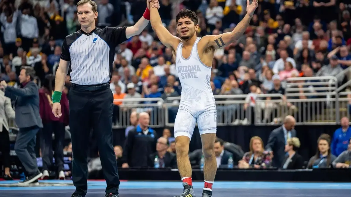 Image from ASU News wrestler celebrating win