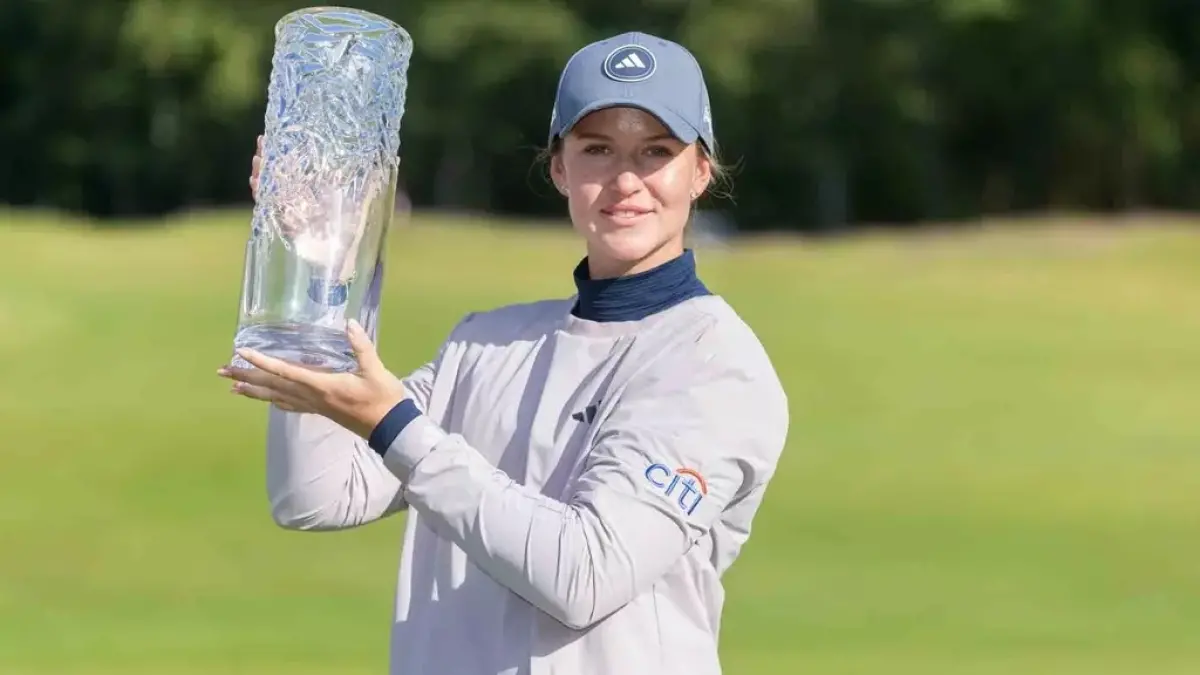 Image from ASU News woman holding award